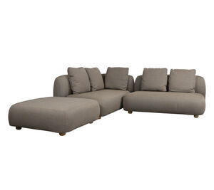 Hjørnesofa med chaiselong i taupe. L-formet, afrundet design med bløde hynder og matchende puder.